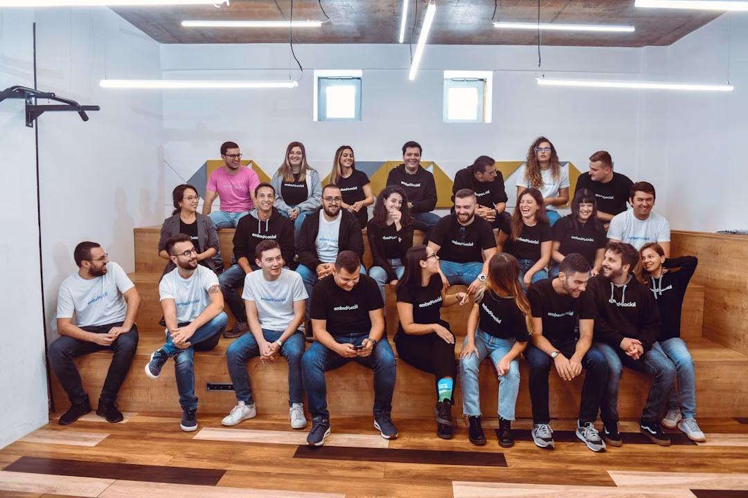 The Skynet team gathered on the office bleacher seating.